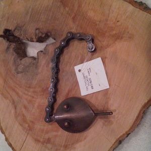 Bottle opener, upcycled bicycle chain snake head